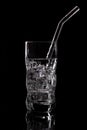Glass of sparkling water soda drink with ice on black background Royalty Free Stock Photo