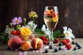 glass of sparkling wine with fruit and flowers Royalty Free Stock Photo