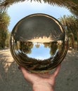 Glass sphere in hand. Vai. Crete
