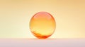 A glass sphere with orange and yellow hues sits on a light pink surface. Royalty Free Stock Photo