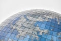 Glass spherical modern building with reflection of blue sky Royalty Free Stock Photo