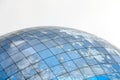 Glass spherical modern building with reflection of blue sky Royalty Free Stock Photo