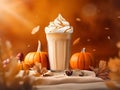 Glass of spicy pumpkin latte with whipped cream and cinnamon over blurred background with bokeh lights and autumn leaves. Coffee