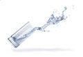 Glass with spilling water splash. Side view. On white background Royalty Free Stock Photo