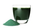 Glass with spirulina drink and pile of powder