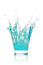 Glass with splashing blue drink