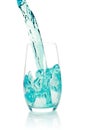 Glass with splashing blue drink Royalty Free Stock Photo