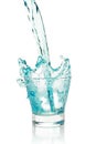 Glass with splashing blue drink Royalty Free Stock Photo