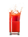 Glass of splashing tomato juice isolated on white. Tomato splash