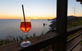 A glass of spritz in front of a beautiful sunset Royalty Free Stock Photo