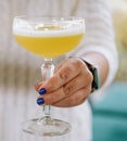 Glass of star martini in the hands of a girl Royalty Free Stock Photo