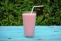 Glass of strawberries, cherries smoothie with straw on wooden table. Protein cocktail. Healthy drink. Fresh homemade smoothie. Hea Royalty Free Stock Photo