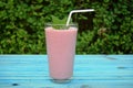 Glass of strawberries, cherries smoothie with straw on wooden table. Protein cocktail. Healthy drink. Fresh homemade smoothie. Hea Royalty Free Stock Photo