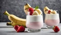 A glass of strawberry and banana yogurt with a strawberry on top