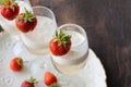 Glass of strawberry cocktail or mocktail, refreshing summer drink with champagne, strawberries, ice cream Royalty Free Stock Photo