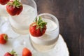 Glass of strawberry cocktail or mocktail, refreshing summer drink with champagne, strawberries, ice cream Royalty Free Stock Photo