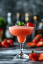 A glass of strawberry daiquiri cocktail and fresh strawberries on the table Royalty Free Stock Photo