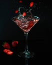 Glass with strawberry drink martini splash Royalty Free Stock Photo
