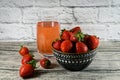 A glass of strawberry juice and strawberries Royalty Free Stock Photo