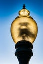 Glass street lamp head on a cast iron post Royalty Free Stock Photo