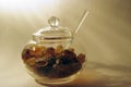 Glass sugar bowl with brown caramelized sugar