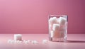 A glass of sugar cubes on a pink table