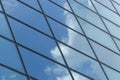 Glass surface of a building with reflection of a cloud Royalty Free Stock Photo