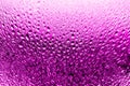 Glass surface in drops of water, bright pink color, shiny drops texture, wet background, light gradient, close up Royalty Free Stock Photo