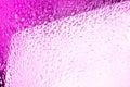 Glass surface with water drops, bright pink color, shiny drops texture, wet background, light purple gradient, close up