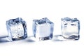 a glass table with three melting ice cubes on a white background Royalty Free Stock Photo