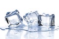 a glass table with three melting ice cubes on a white background Royalty Free Stock Photo