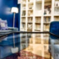 Glass table top with a blurred home interior background. Empty space background for you products and decoration. Royalty Free Stock Photo