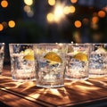 a glass table top with a collection of clear glasses filled with slices of fresh limes