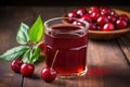 glass of tart cherry juice on a wooden table