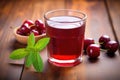 glass of tart cherry juice on a wooden table