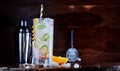 Glass of tasty cocktail placed on bar counter