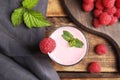 Glass of tasty fresh raspberry smoothie on wooden table, flat lay Royalty Free Stock Photo