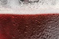 Glass of tasty red beer with foam closeup Royalty Free Stock Photo