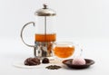 Glass tea pot with double sided wall glass cup full of green tea with sweets and biscuits