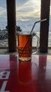 a glass of tea on the table against the sea background Royalty Free Stock Photo