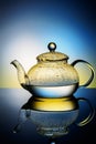 Glass teapot with boiling water and drops of condensation Royalty Free Stock Photo