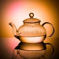 Glass teapot with boiling water and drops of condensation Royalty Free Stock Photo