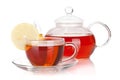 Glass teapot and cup of black tea with lemon slice Royalty Free Stock Photo