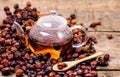 Glass Teapot of Herbal Dog Rose Tea With Dried Rosehips, Types Rosa Canina Hips Hot Drink of Medicinal Plants and Herbs Wooden Royalty Free Stock Photo