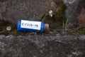 Glass test tube with a label and the inscription covid-19 on it on an isolated background