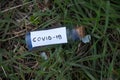 Glass test tube with a label and the inscription covid-19 on it on an isolated background
