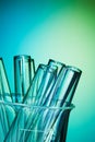 Glass test tubes together on the blue background