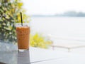 Glass of Thai milk tea with ice and straw on white table Royalty Free Stock Photo