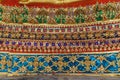 Glass tile mosaic and gold leaves beneath the Buddha statue, Thai Traditional Art Paint Pattern