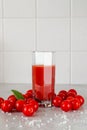 A glass of tomato juice and cherry tomatoes Royalty Free Stock Photo